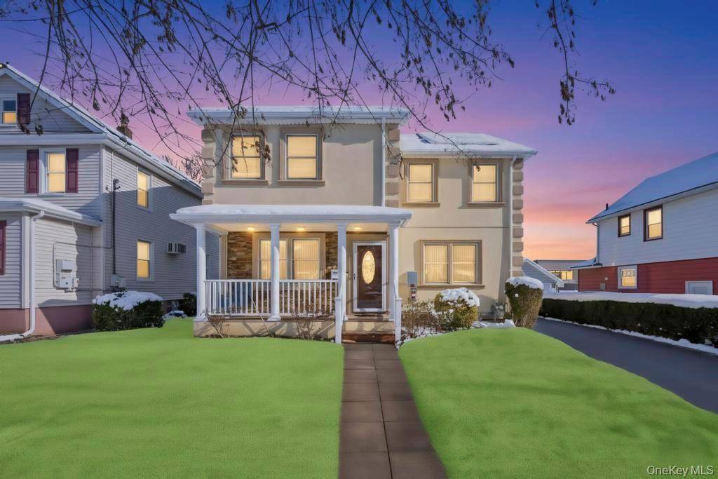 Welcome to this stunning stucco colonial home located in the heart of Mineola.