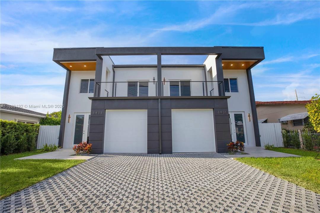 This newly built townhome, moments from Coral Gables, blends sleek architecture with timeless sophistication.