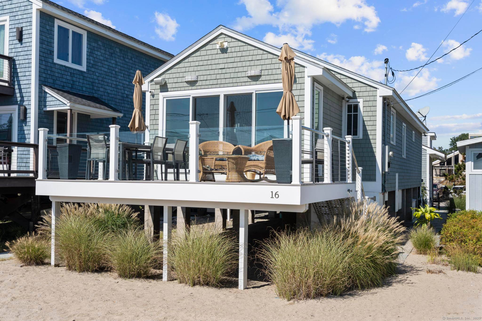 Step into this beautifully renovated 2 bedroom, 1 1 2 bathroom coastal haven, where luxury meets relaxed beachside living.