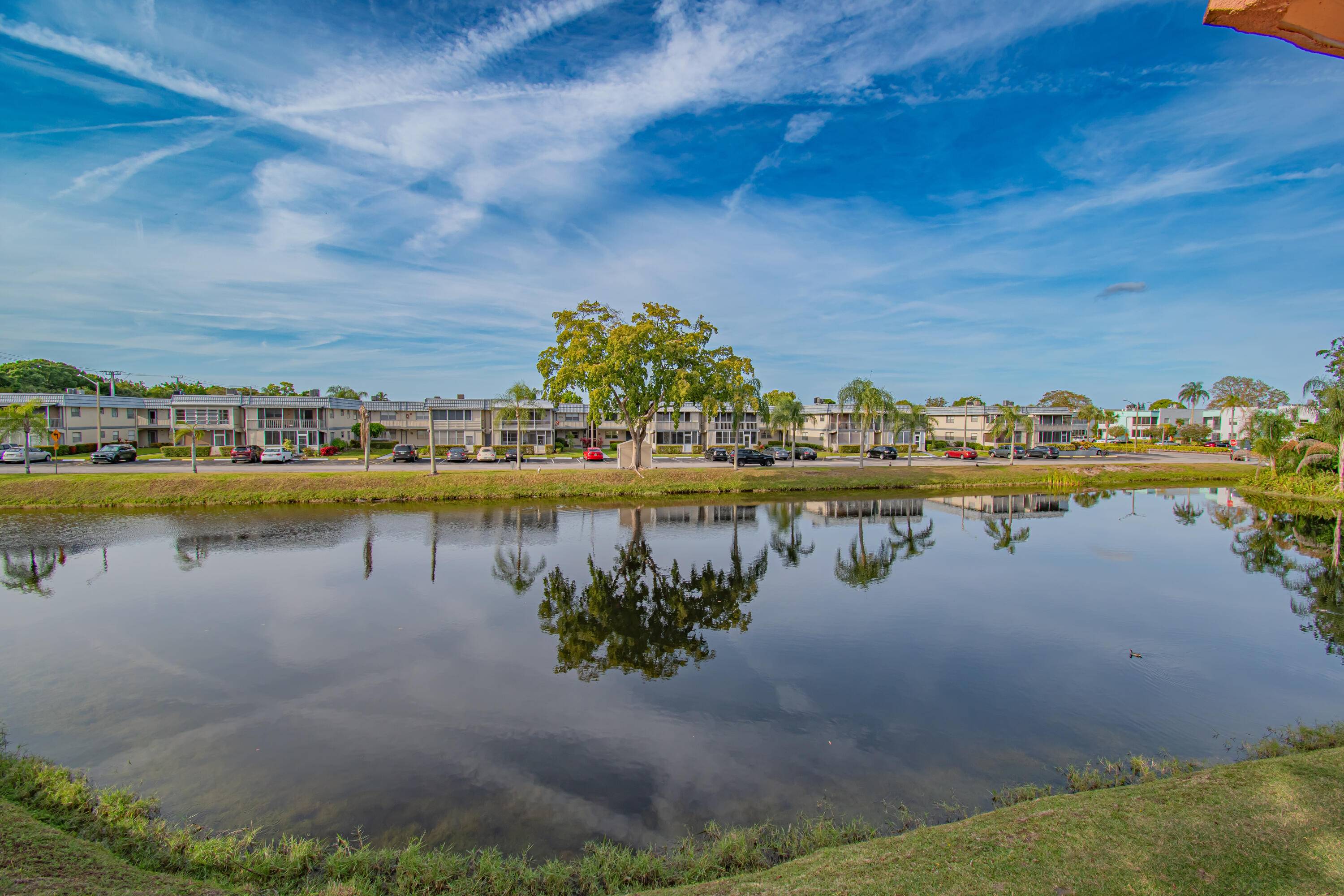 LAKE VIEWS ! ! Beautiful Private Corner Unit Light and Bright 2 Bed 2 Bath located in the Saxony Section of 55 Kings Point Golf and Country Club !