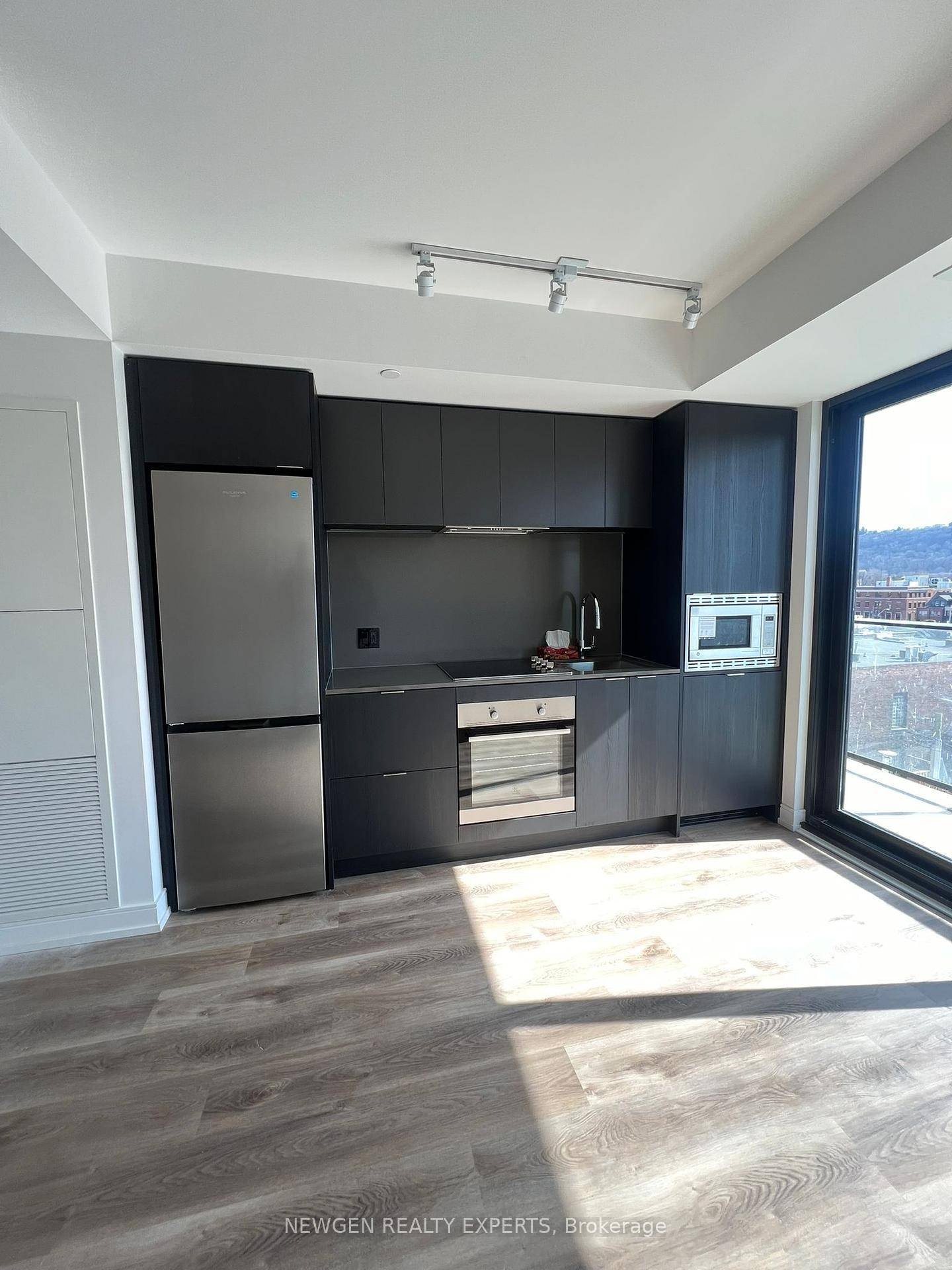 Modern condo in Hamilton's prime location with easy access to Hwy 403, QEW, Red Hill Valley Parkway, West Harbour, and Hamilton GO Station.