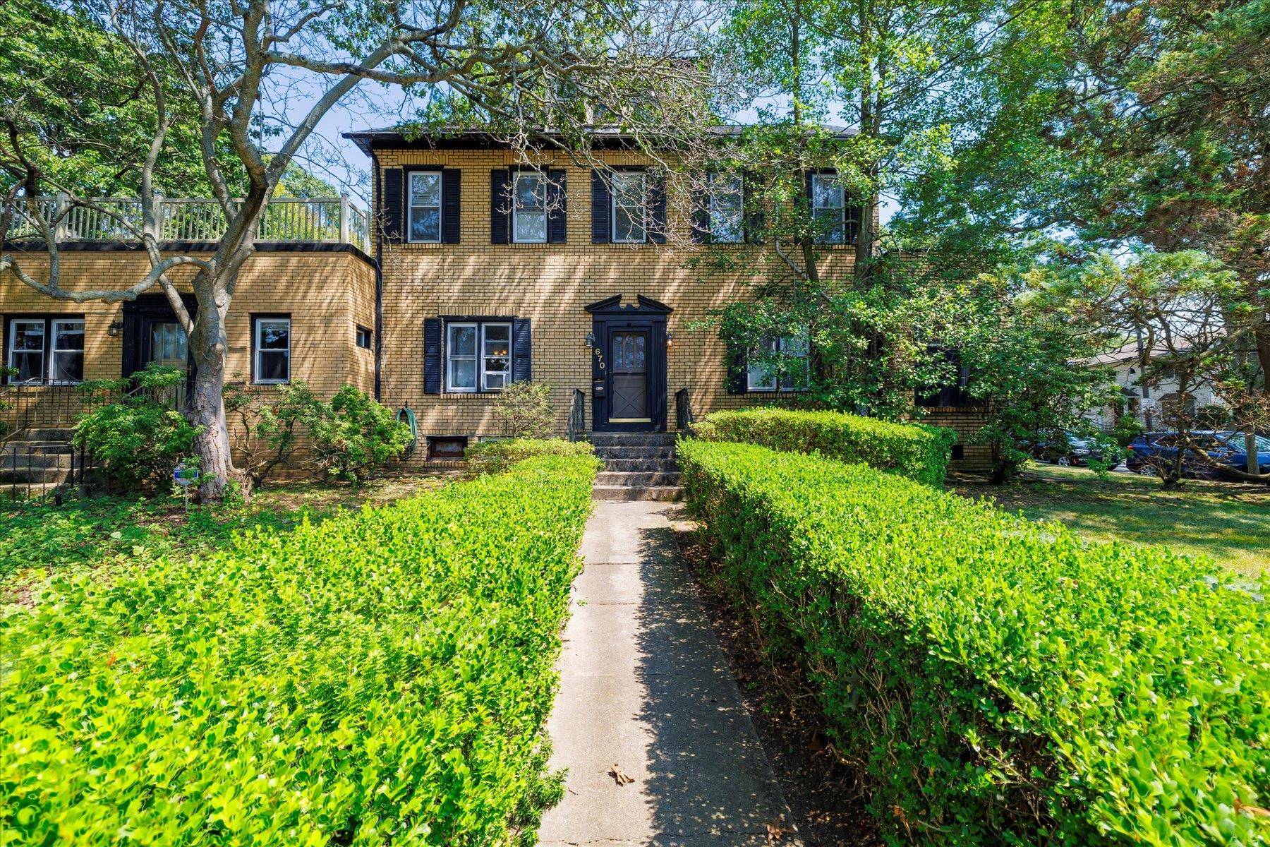 Welcome to this impressive double brick colonial set on one of the largest properties in West Hempstead.