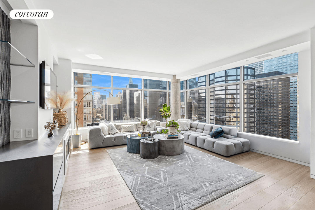 Welcome to an exquisitely renovated three bedroom, three bathroom residence in one of Midtown East's most sought after full service condominium buildings.