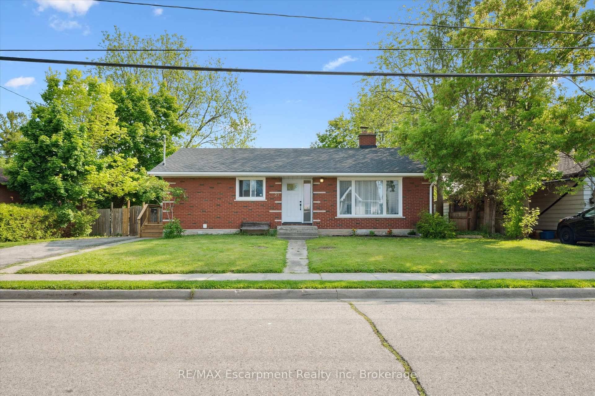 The moment you walk into the lower level of this warm and welcoming bungalow, you feel it the heart of the home is here.