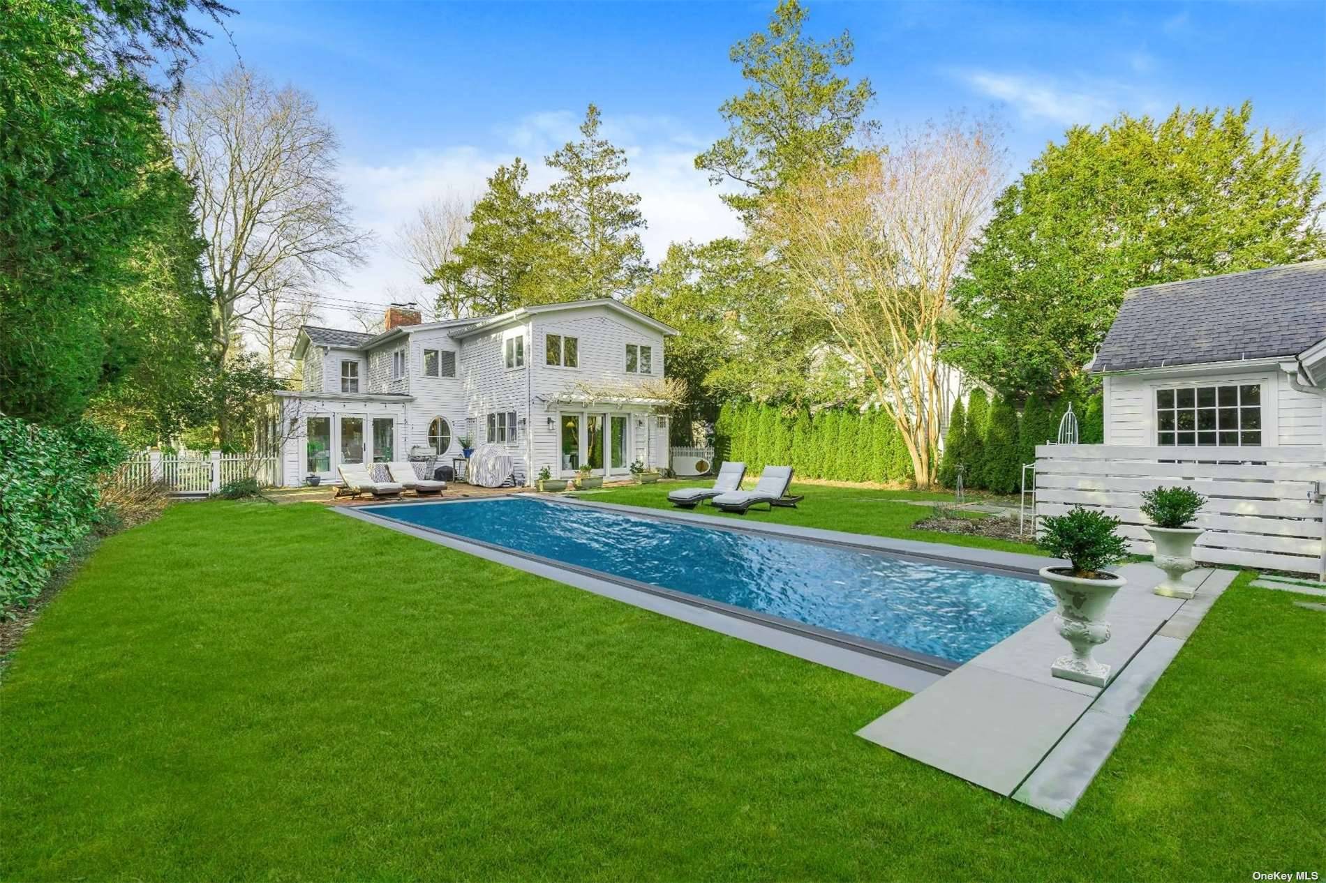 Step into casual charm at 178 South Country Road, nestled in the heart of Bellport's coveted historic village.