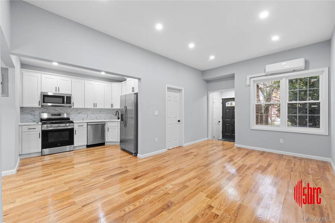 Stunning fully renovated attached brick home in the heart of Cambria Heights !