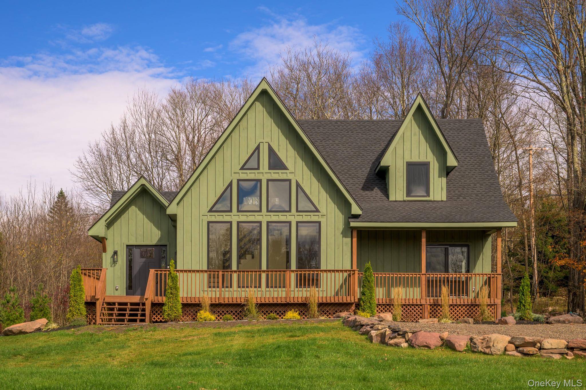 Experience contemporary mountain living at its finest in this exceptional new construction residence, perfectly positioned just one mile from the Village of Windham.