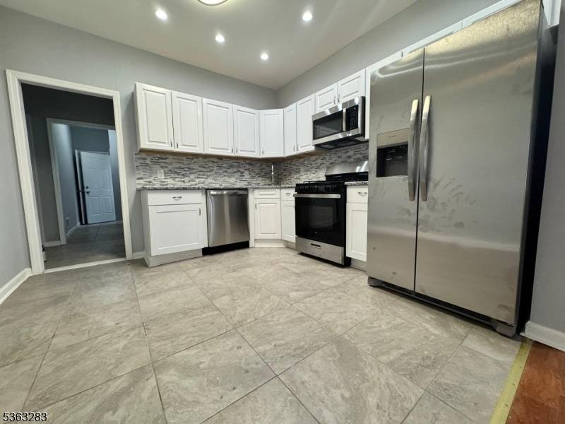 The 2 family Home features a total of 8 bedrooms and 3 bathrooms.