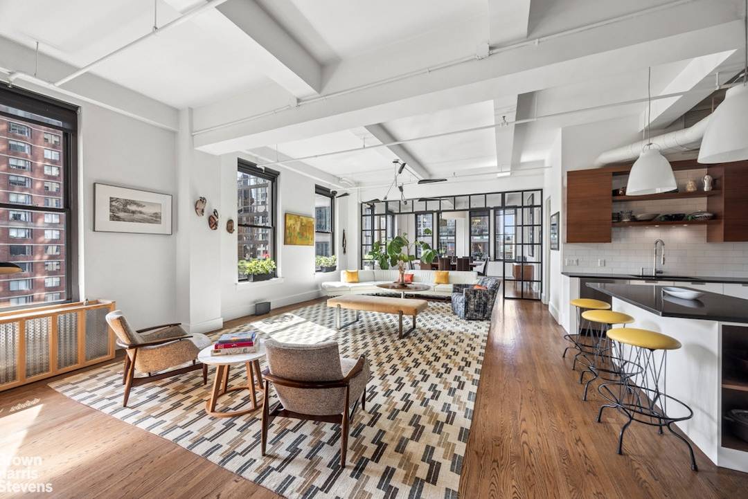 Gorgeously renovated full floor condo loft in prime Chelsea with spectacular light and open views.