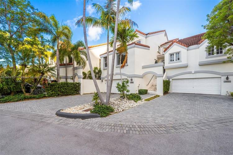 Live the waterfront lifestyle in this elegant townhouse overlooking the Intracoastal !