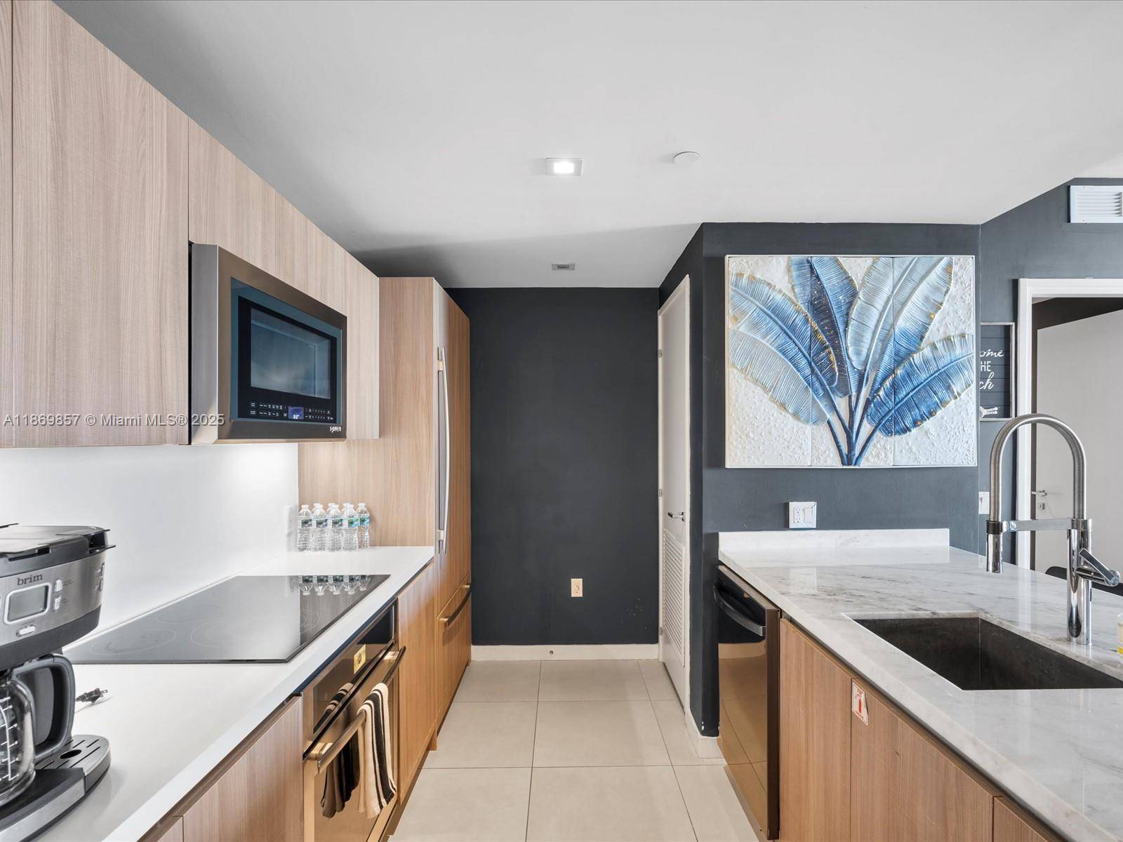 Experience luxury living with stunning water views in this modern condo at Tiffany House, just a block from the beach and Intracoastal.