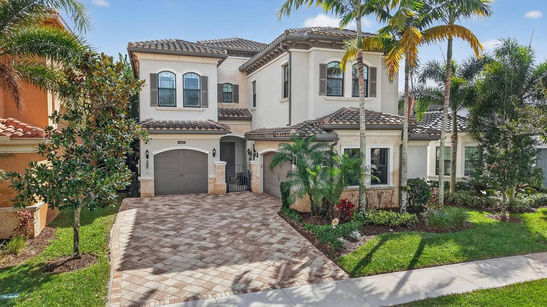 Step into this sunlight filled Anabelle pool home in Seven Bridges of Delray Beach, where soaring ceilings, dramatic windows, and a chef's kitchen create a bright and spacious luxury home.