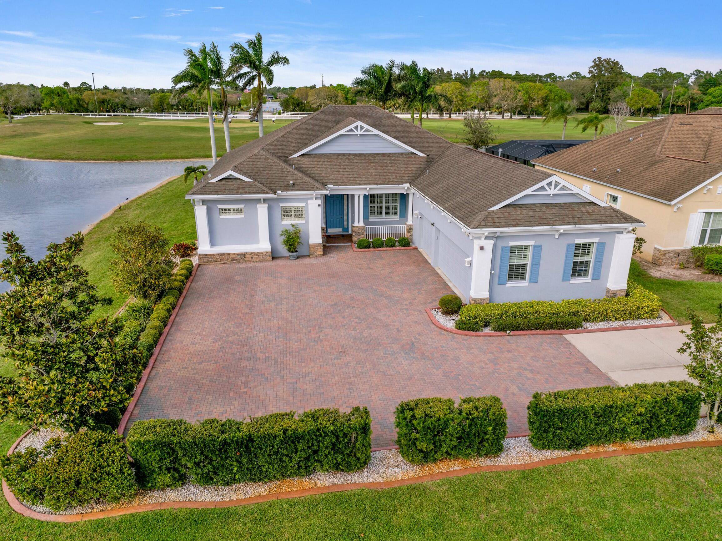 Situated on the 3rd largest lot in the community and easily the best lot location with 90 Degrees of waterfront and views of hole 17 18.