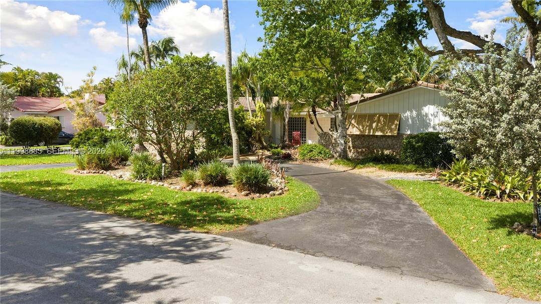Tucked away on a quiet street in Pinecrest, this 4 bedroom, 2.