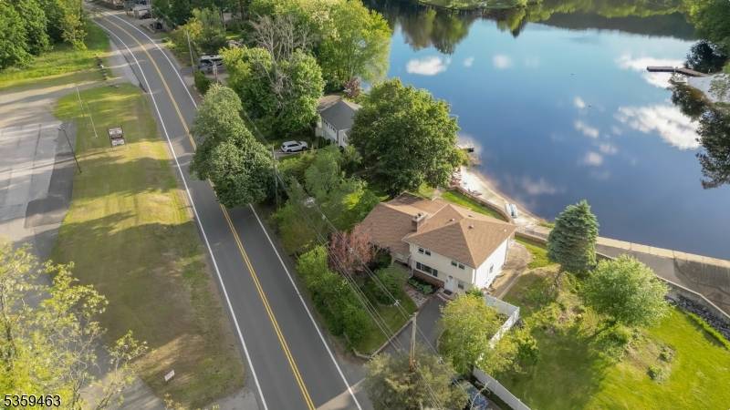 Welcome to this spacious 4 bedroom split level home, perfectly situated on a large lakefront lot on the serene shores of Lake Swannanoa.