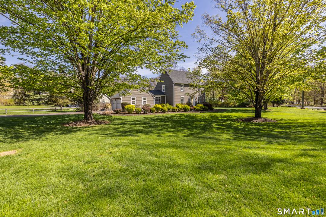 Welcome to this charming Colonial, beautifully situated on a level one acre corner lot.