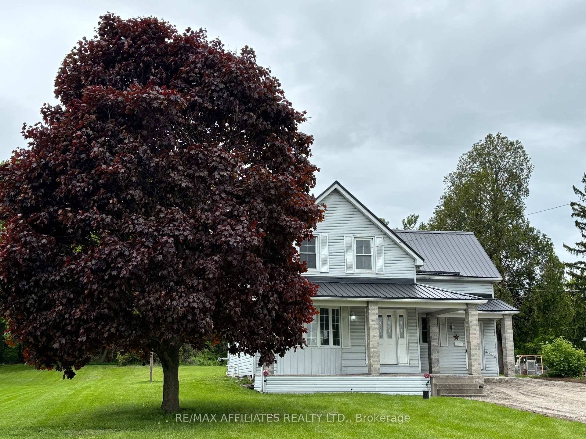 Nestled on a generous lot on the edge of town, this charming family home offers a harmonious blend of classic charm and modern comforts with extensive renovations made over time.