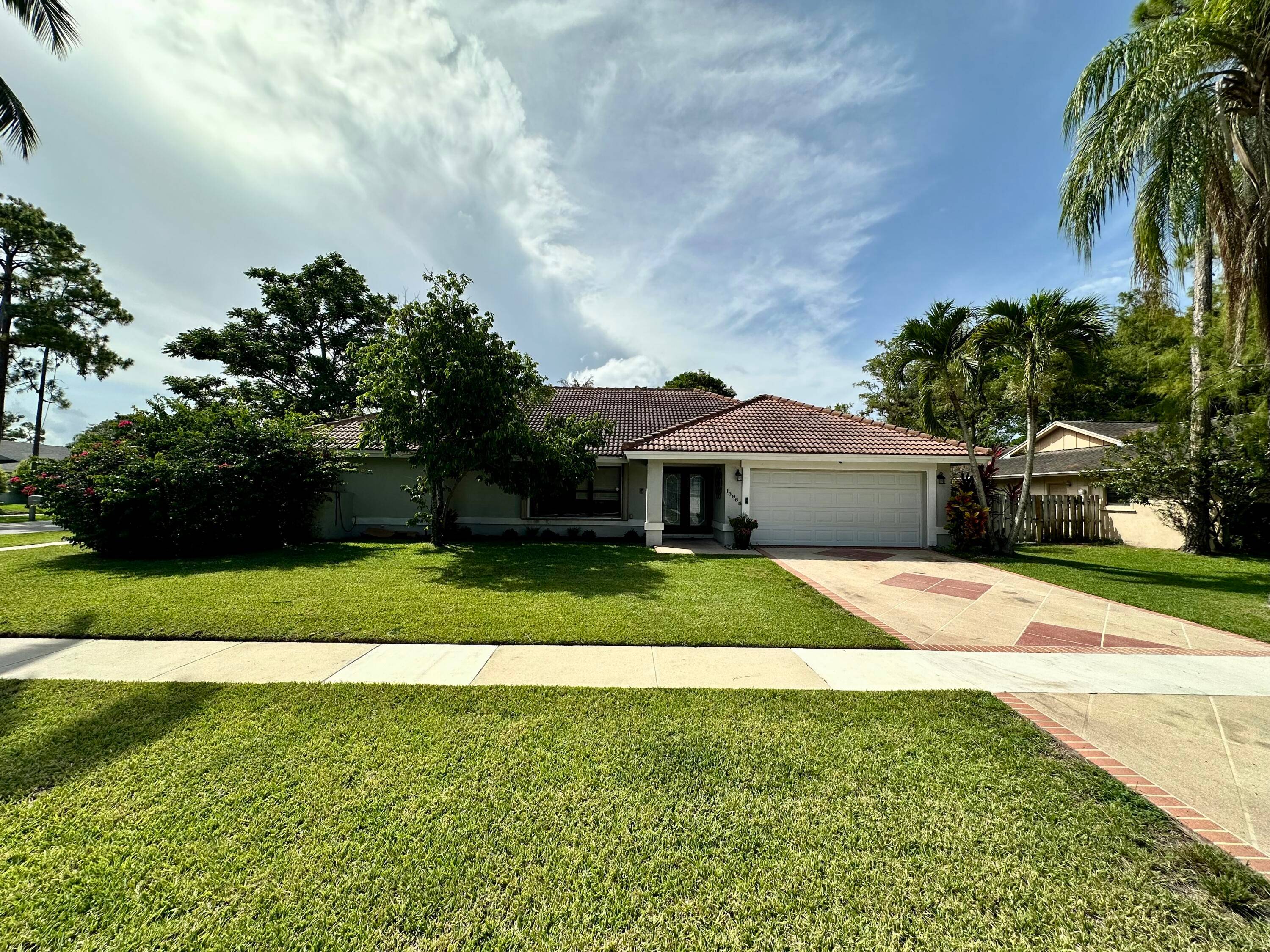Spacious 4 bedroom, 2. 5 bath single family home with a private pool, located on a large corner lot in Wellington.