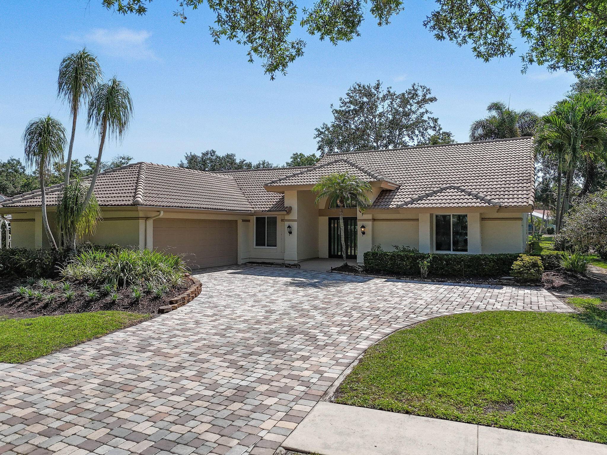 You will love everything about this beautifully updated home on the lake in The Shores of Jupiter.