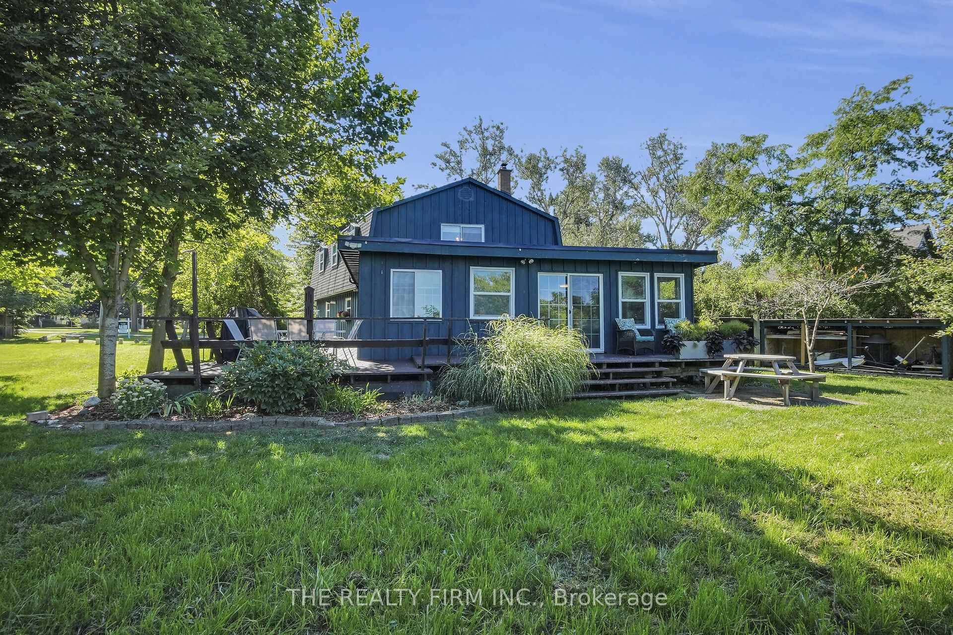 Escape to your private lakefront oasis, a hidden gem on a quiet dead end street in a charming enclave, just 20 minutes from Sarnia and an hour from London.