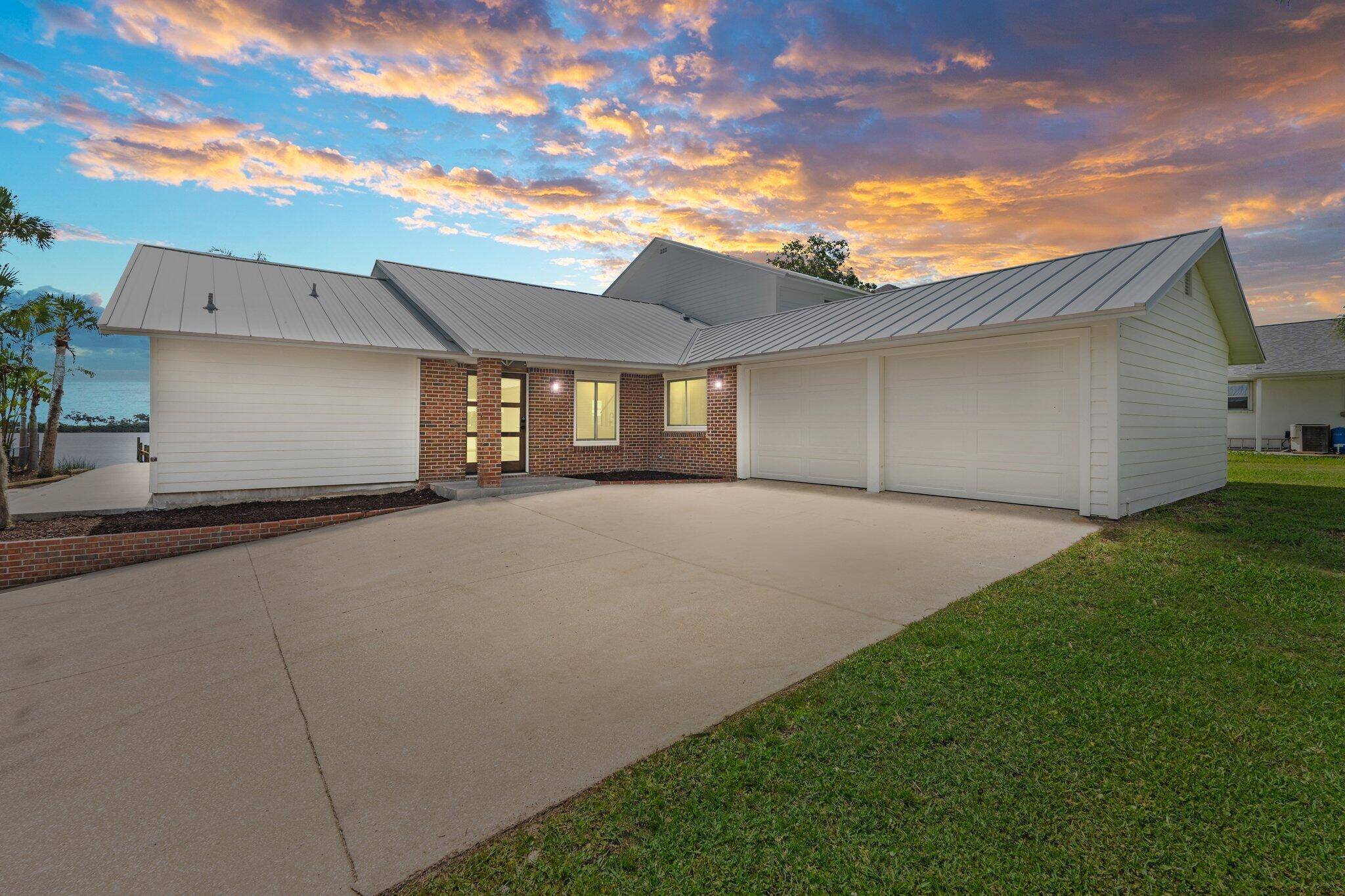Riverfront paradise with private pool, 4 beds, 3 baths, and garage space for 4 cars !