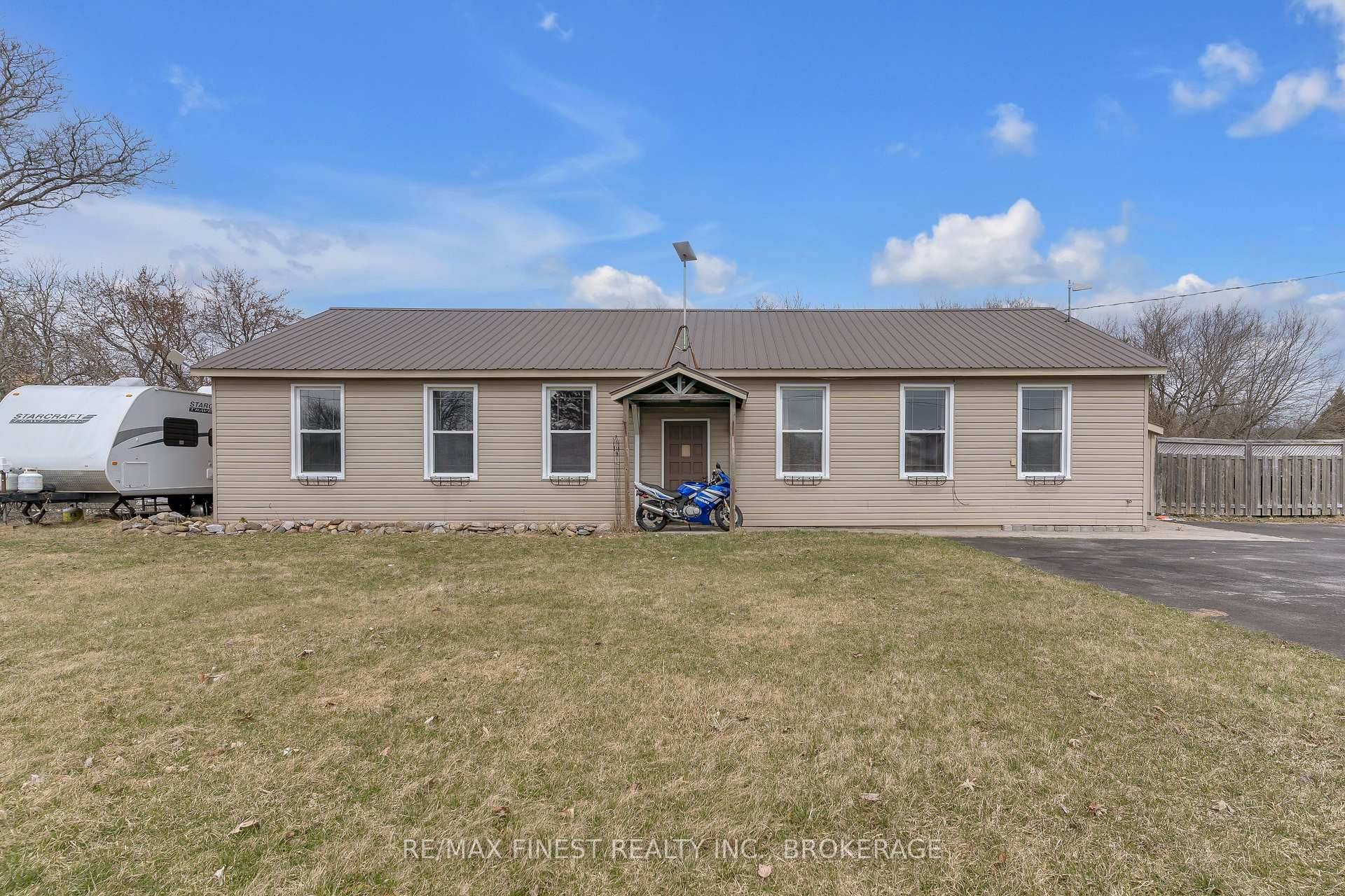 Welcome to 6955 County Road 2, a rare and exciting opportunity located just outside of Napanee, on the outskirts of Loyalist Township.