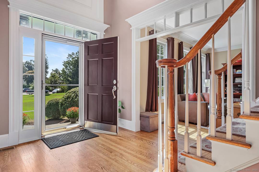 Tucked away on a serene street in the heart of Southport, this 4 bedroom, 4 bath Colonial invites you to experience the perfect balance of elegance, comfort, and privacy.