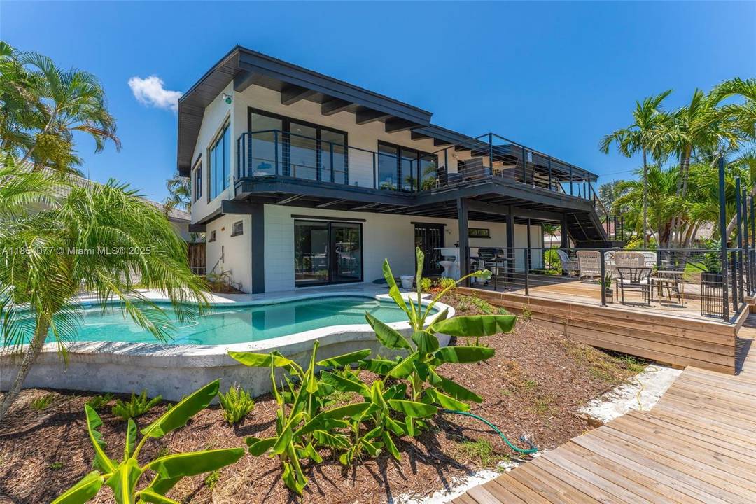 Experience Coastal Living at its finest in this Waterfront Pool Home, featuring 5 bedrooms, 4.