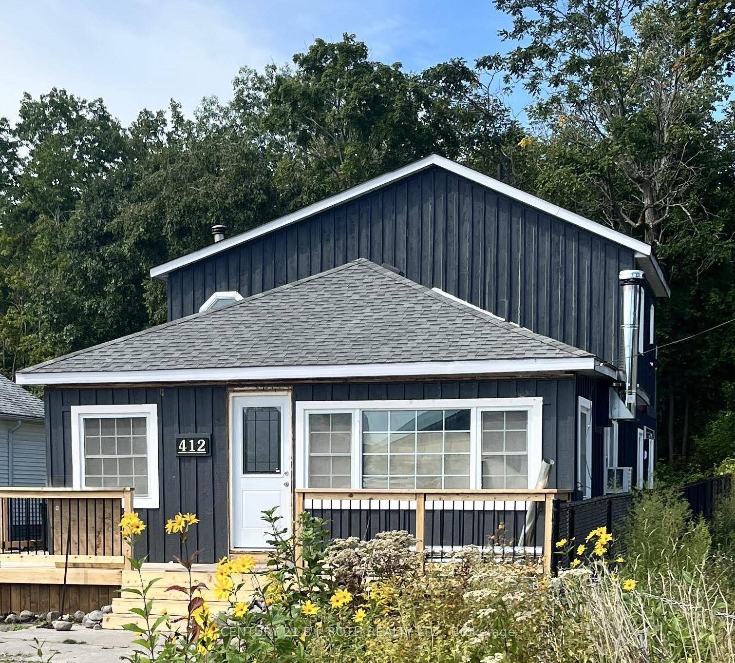 Welcome to 412 Limerick Crescent in Innisfil a rare opportunity just steps from Cooks Bay and Gilford Beach, with dock access for boating and fishing.