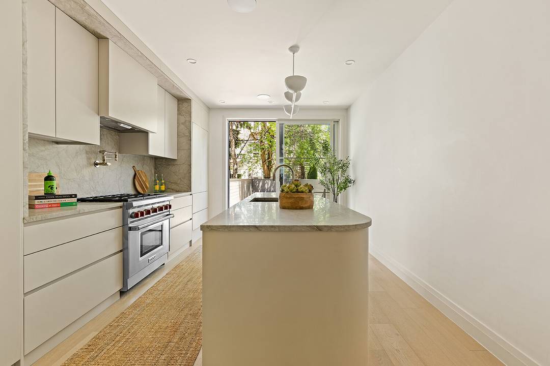 Unmatched luxury awaits in this brand new four story townhome, situated on a peaceful tree lined street in the heart of South Slope.