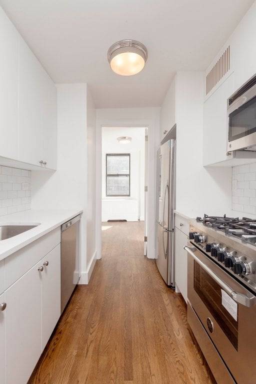 Newly renovated 2 bed 1. 5 bath residence with stainless steel appliances and hardwood floors.