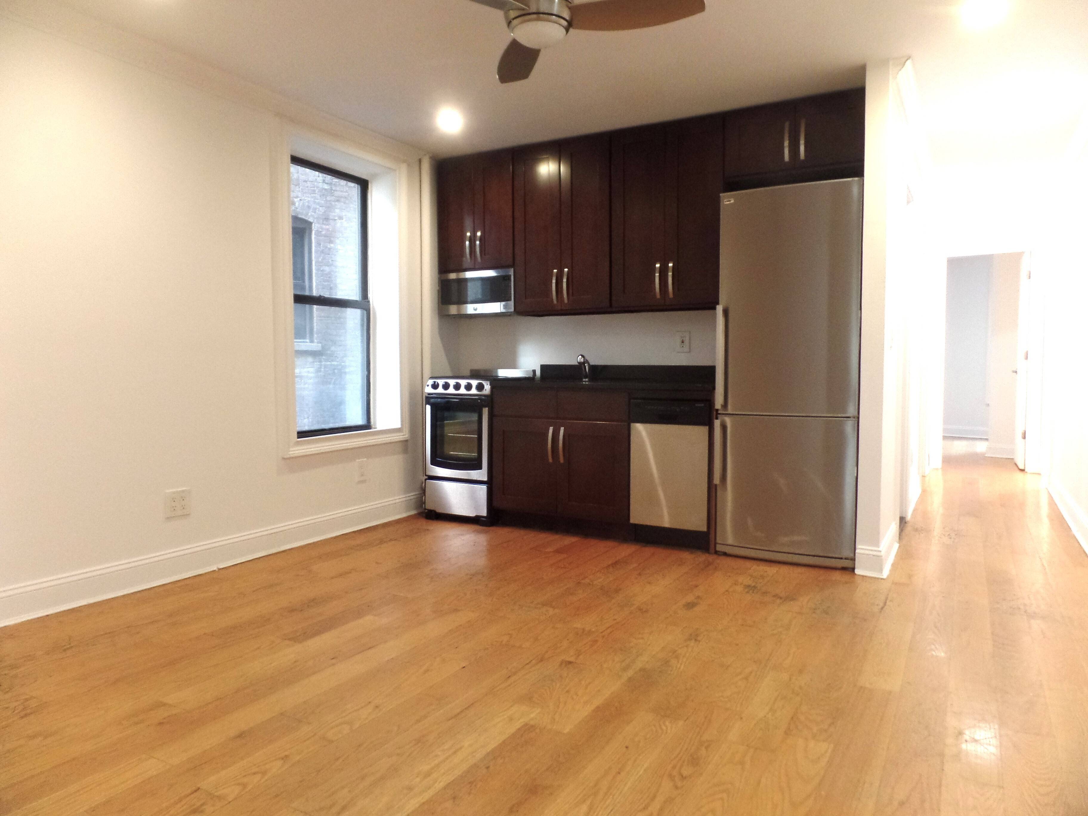 Three bedroom, two full bath apartment with W D in unit, renovated open kitchen with stainless appliances and dishwasher, ample living space, exposed brick.
