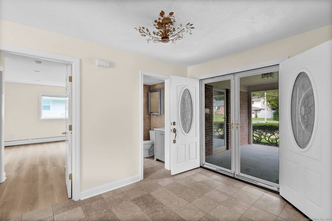 Welcome to this beautifully maintained Split Level residence in one of West Hartford's most desirable neighborhoods.