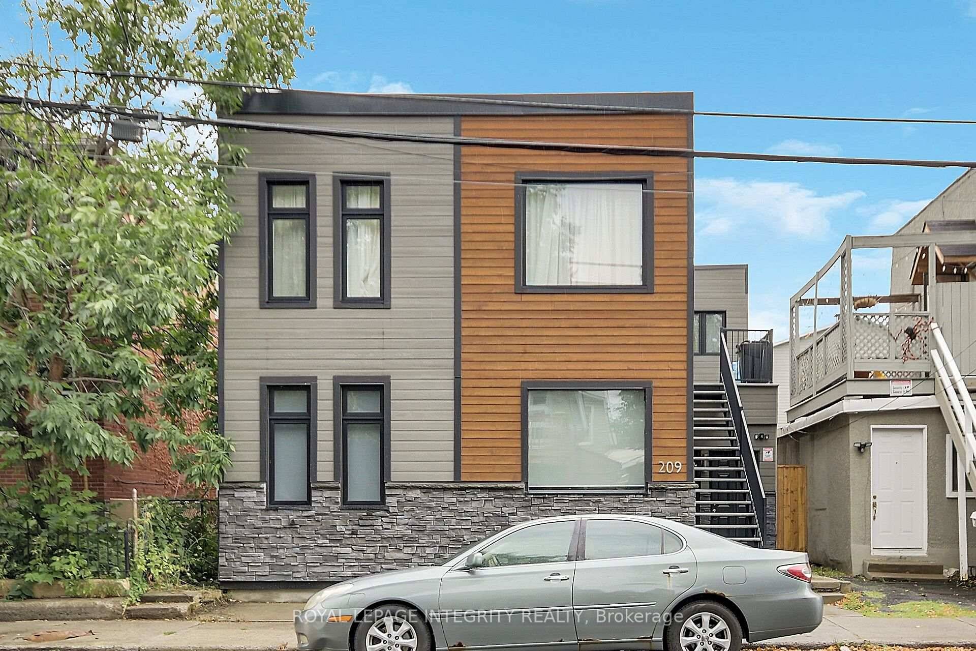 Discover this beautifully renovated legal duplex featuring two expansive 3 bedroom apartments upstairs converted to 2 bedrooms, ideally located just minutes from downtown.