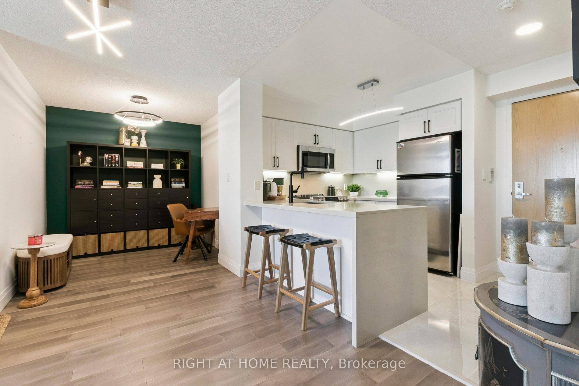 Enter a realm of modern luxury in this 1 bed den, 1 bath condo, a 638 sq.