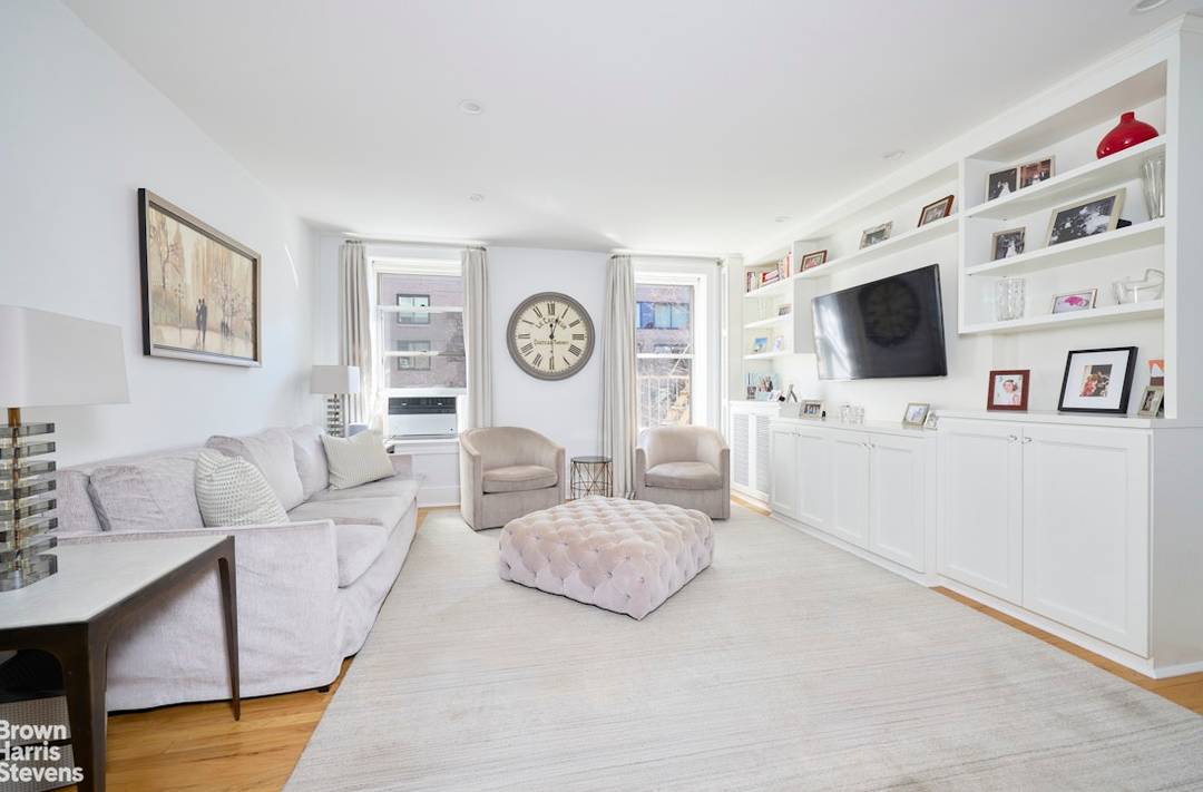 This true three bedroom two bathroom pre war apartment with high ceilings and hardwood floors is located in the heart of Carnegie Hill.