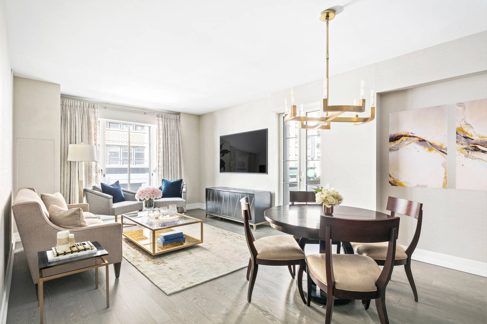 Serene luxury living and a wealth of amenities define this expansive two bedroom, two bathroom residence in a full service Hudson Square condop.