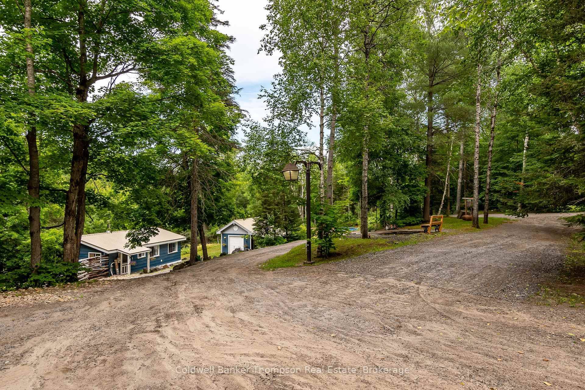 This adorable bungalow is as charming as can be and sits on just over an acre of scenic, usable land.