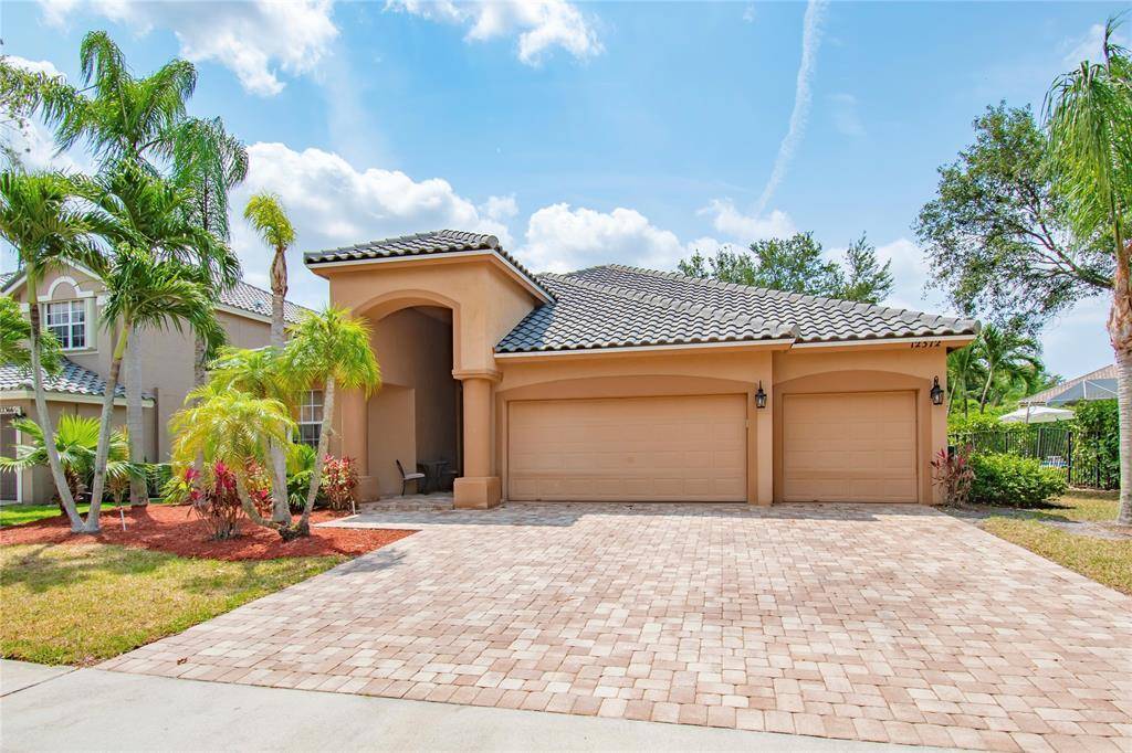Welcome to this Grand, single story 4 bedroom 3 bath, 3 car garage Boca Falls home offering high ceilings, an open floor plan with a Mediterranean flair.