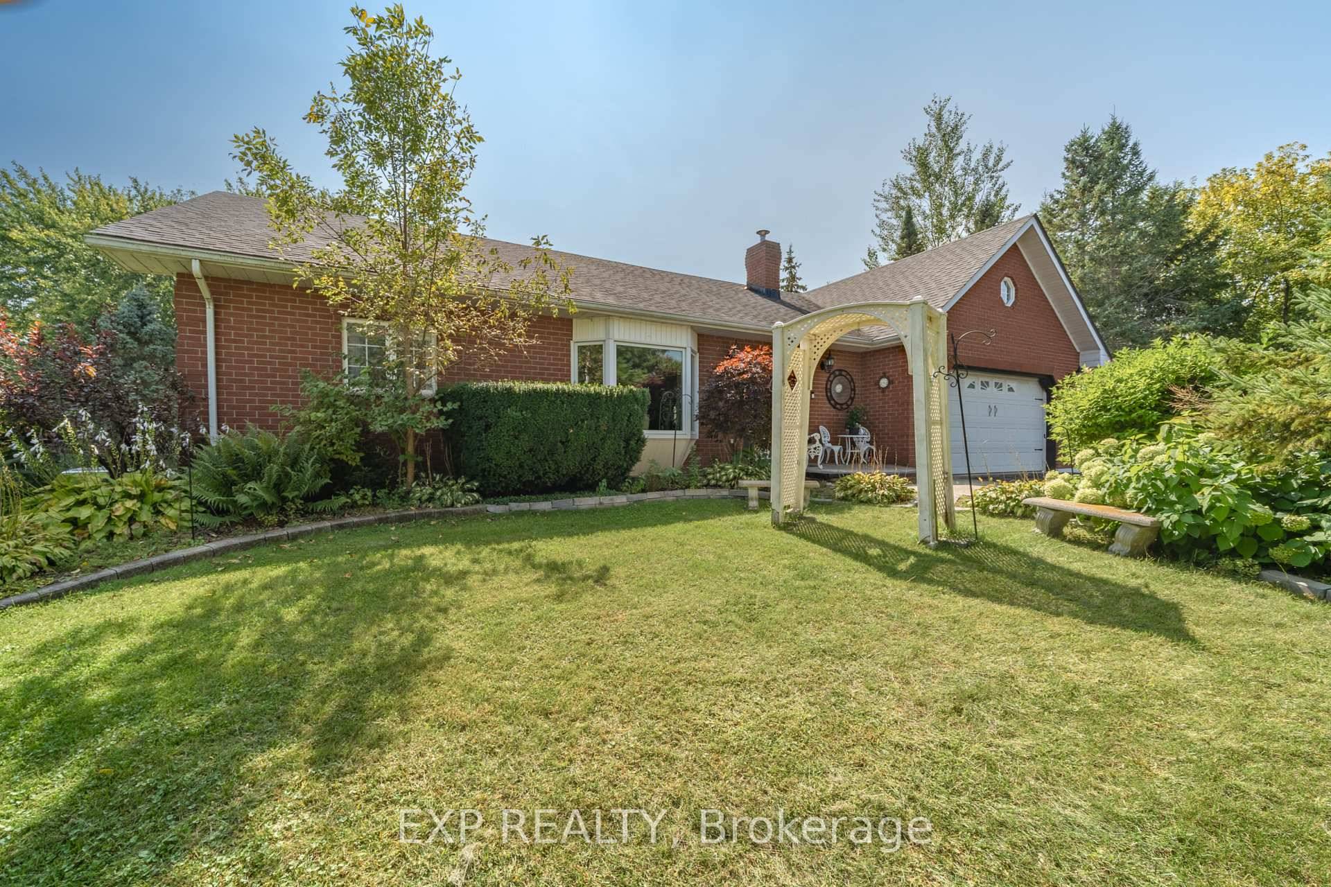 Welcome to 794 Highway 2 in Quinte West, a beautiful all brick home set on a generous 1.