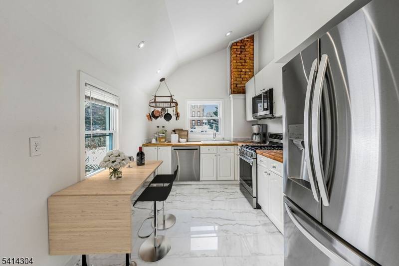 Sunlit and stylish four bedroom, two bathroom duplex in the heart of Montclair move in ready and bursting with charm.