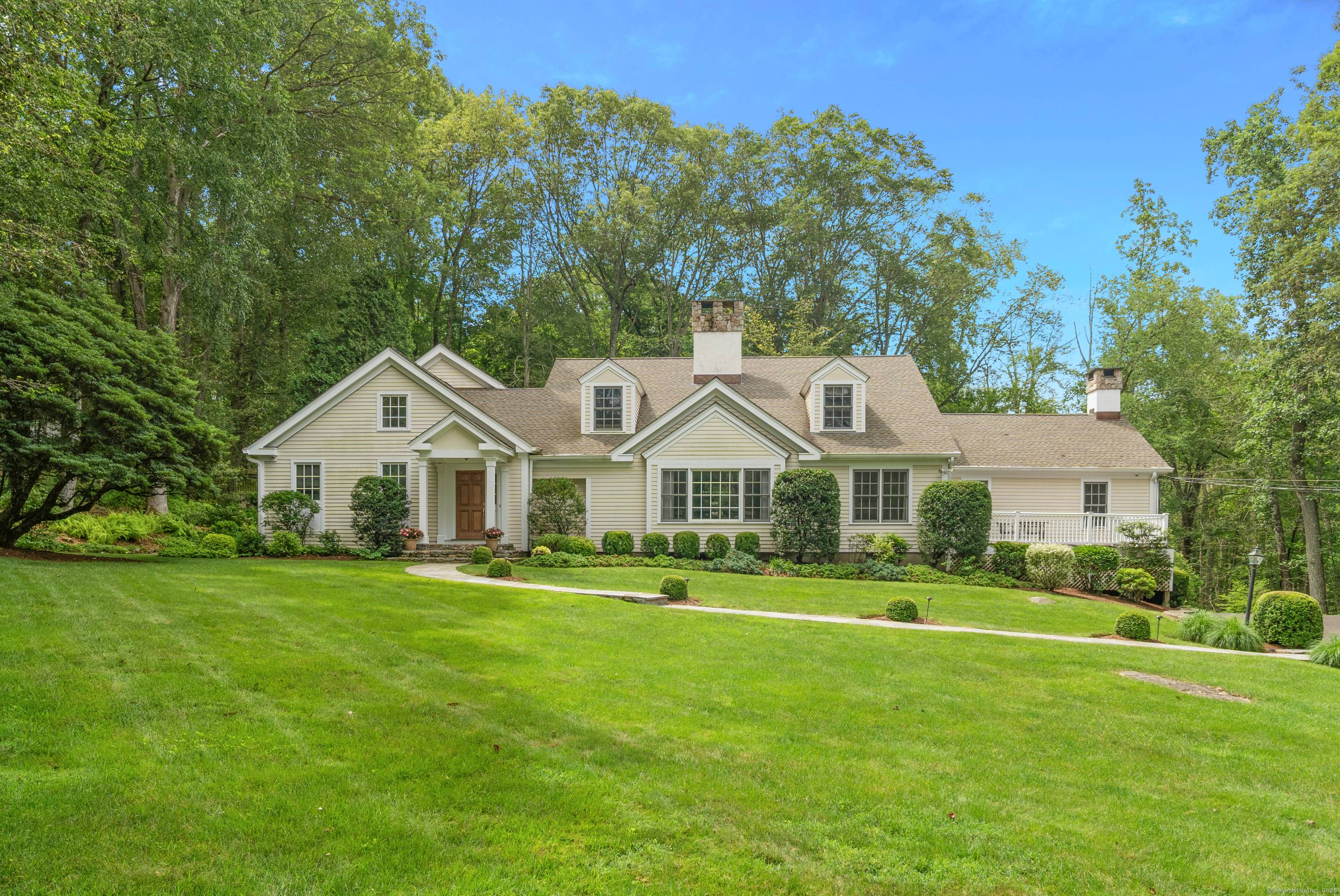 Come delight in seeing an exceptional New Canaan residence designed with style, sophistication and sited on a stunning landscaped 2.