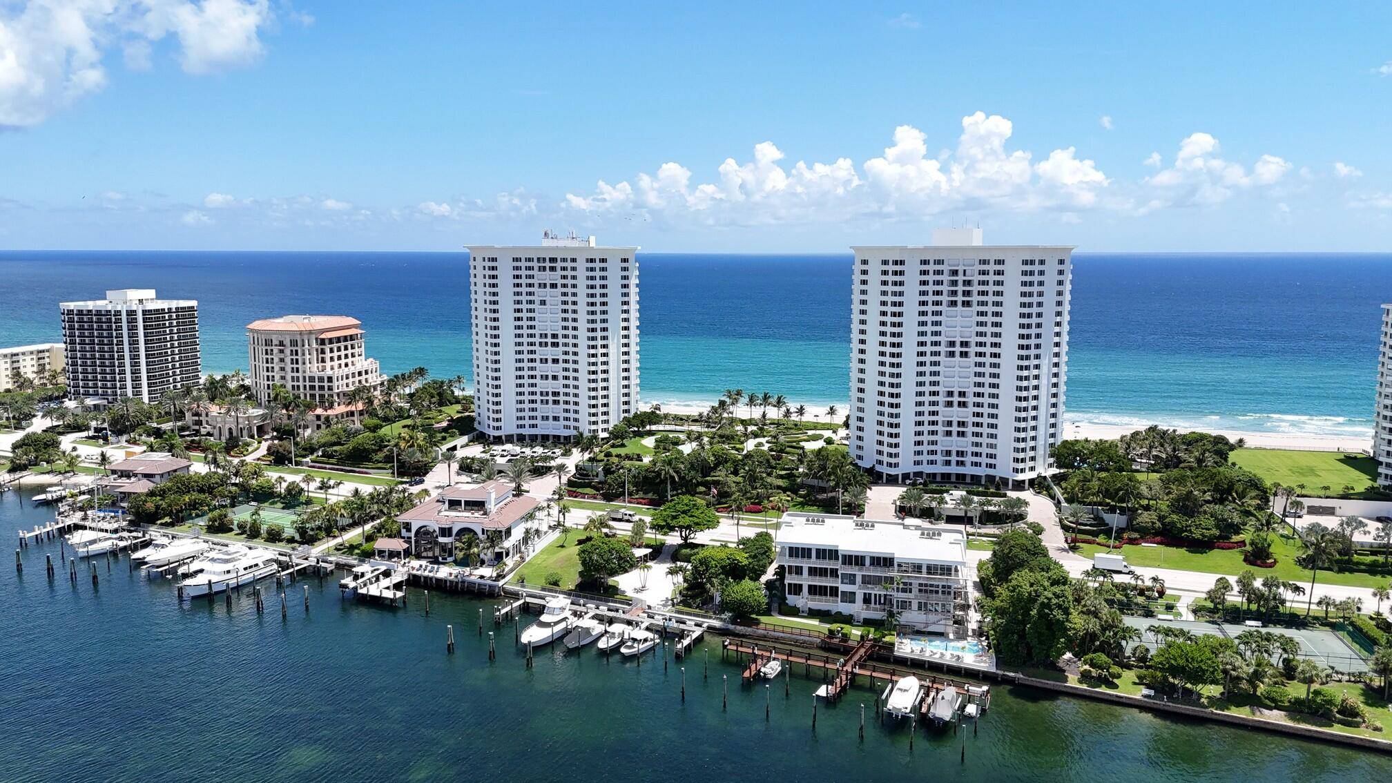 Experience breathtaking views from this unique 10th floor residence, showcasing panoramic vistas of Lake Boca, the city skyline, and spectacular sunsets.