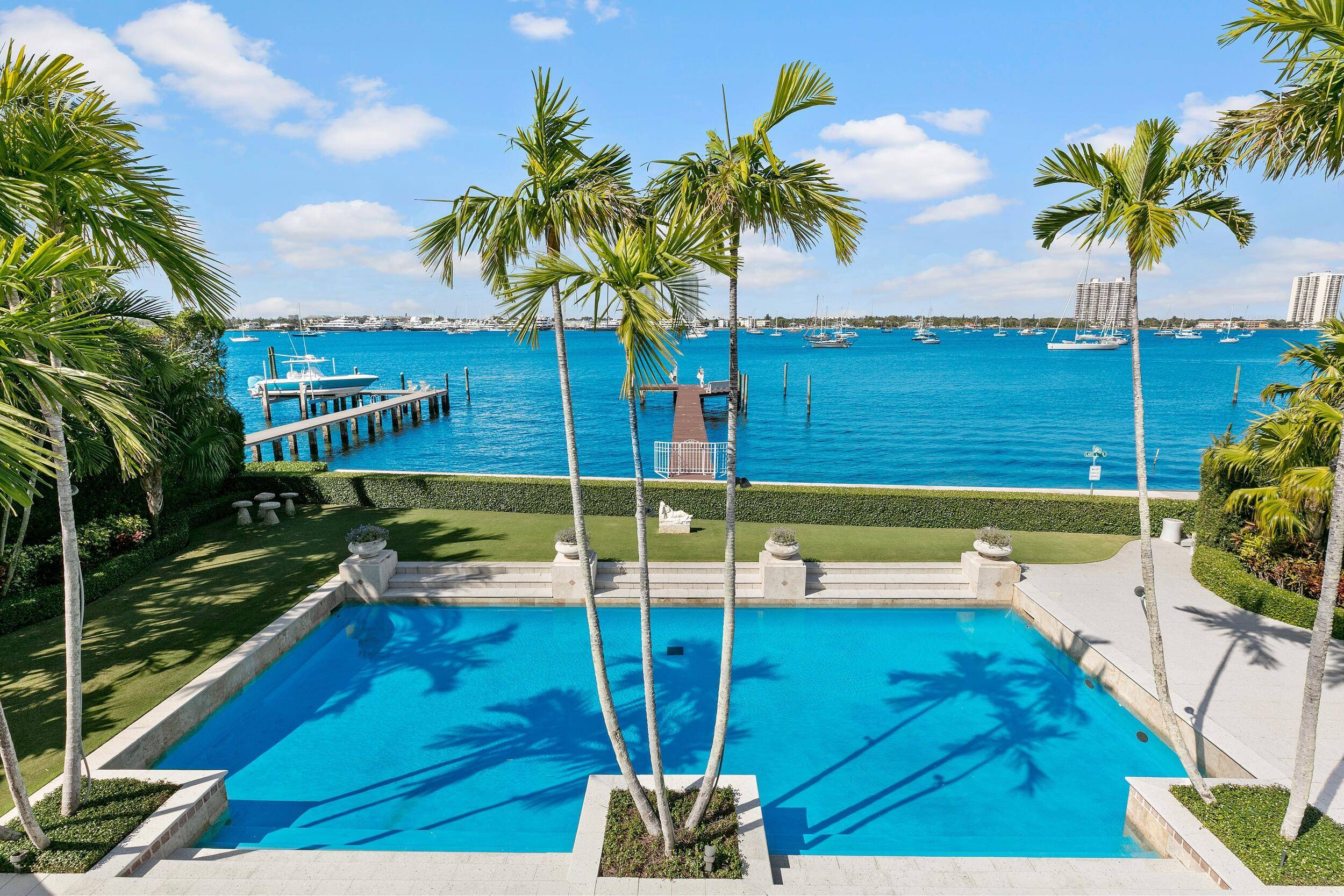 Stunning, contemporary regency with dramatic views of the Intracoastal waterway and the motor yachts at Rybovich Marina.