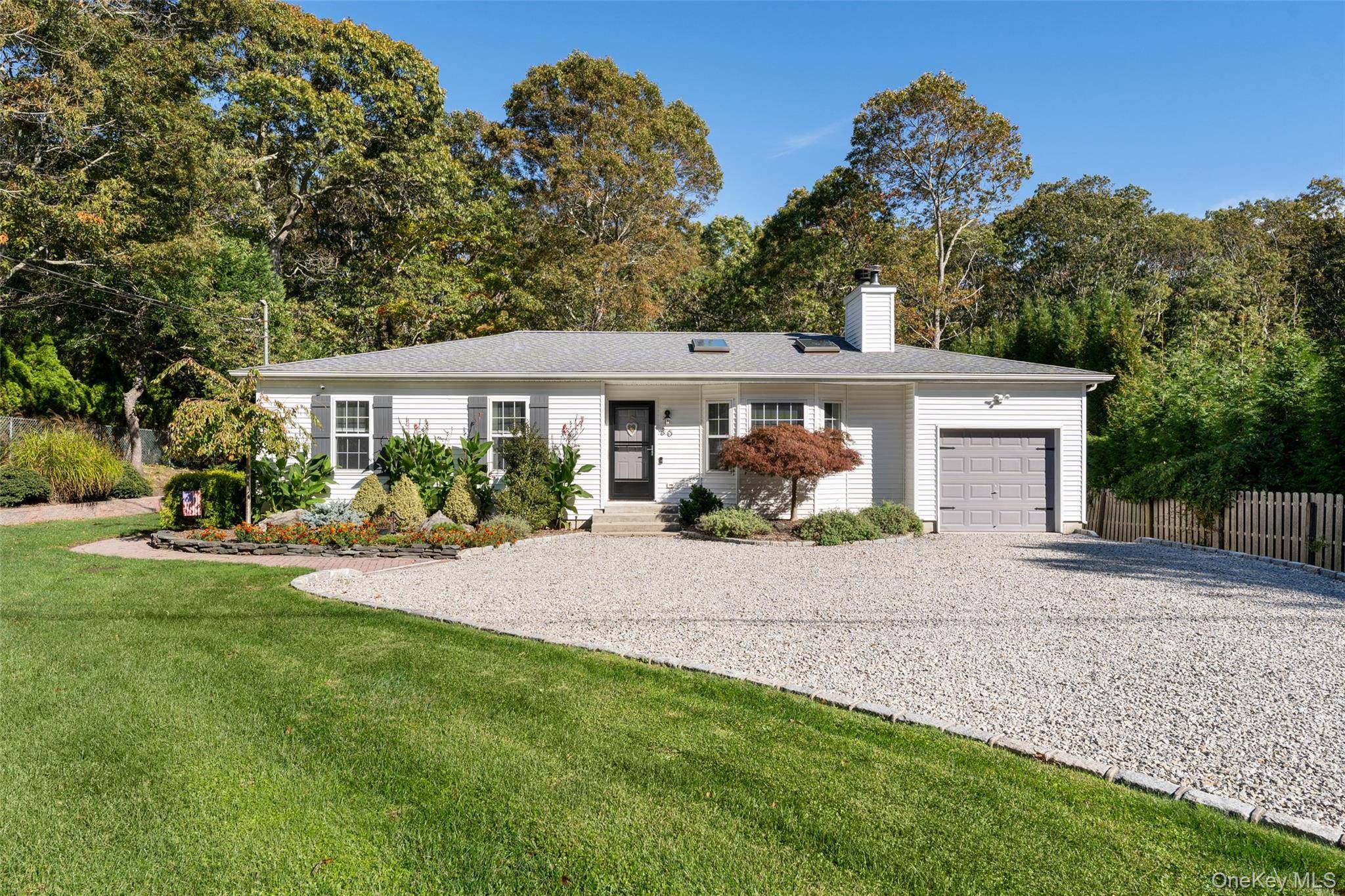 Ideally situated in the heart of Hampton Bays, just one block from the sandy shores of East Landing Lane Beach, this impeccably maintained residence offers the quintessential Hamptons lifestyle.