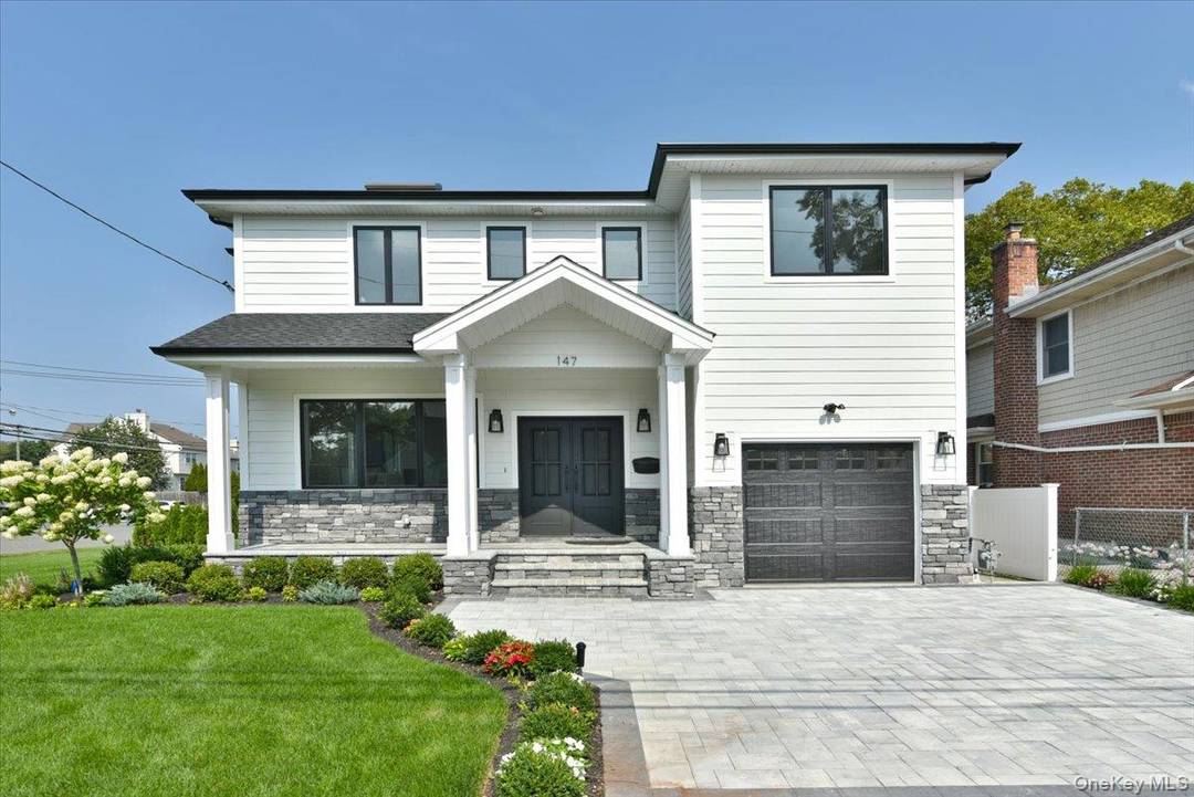 Welcome to 147 Norman Street Where Comfort Meets Sophistication Discover refined living in this beautifully designed single family residence located in the heart of New Hyde Park zoned for prestigious ...