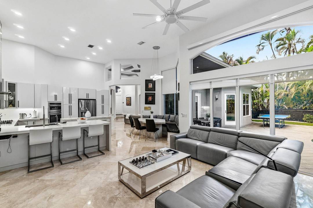 Single story residence offering 4 bdrm w a convertible 5th bdrm option, showcasing newly renovated modern design and architecture and an open, gallery like floorplan curated for refined living and ...