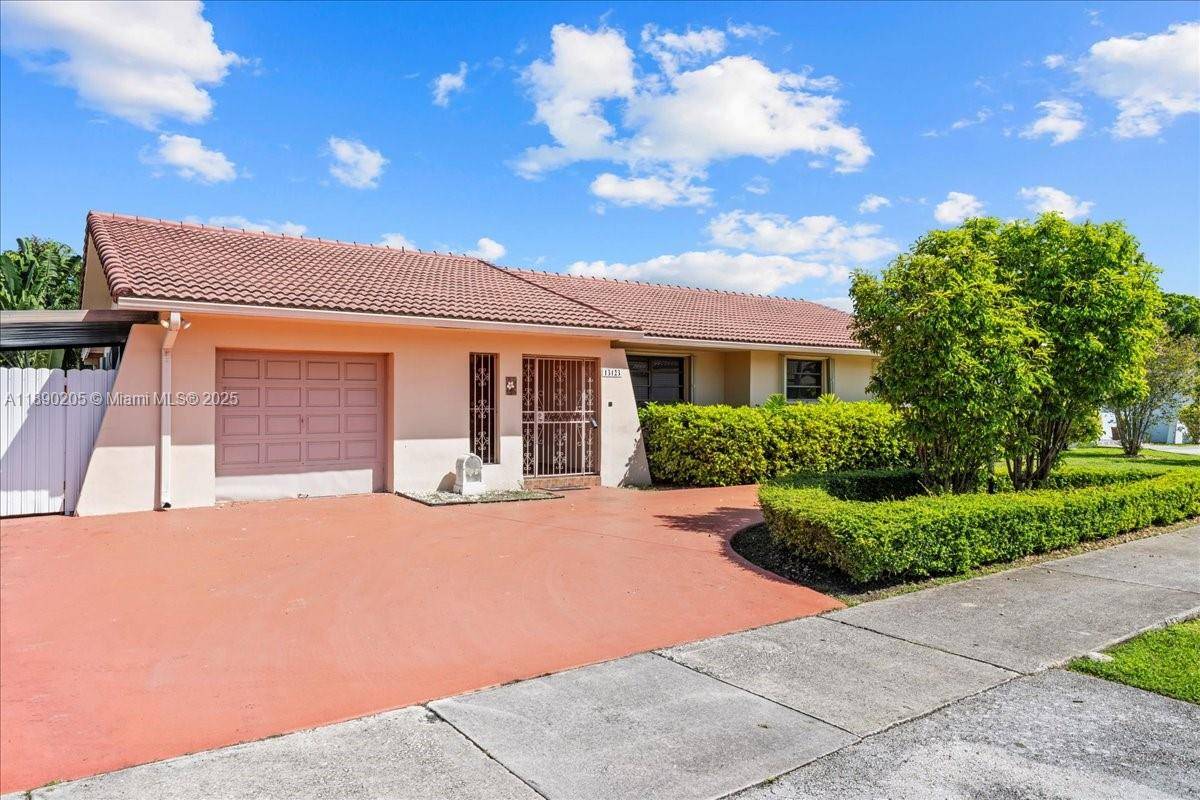 Beautiful 4BR home with 2 fully remodeled baths, 1 car garage that has been converted to more living space, utility and storage rooms.