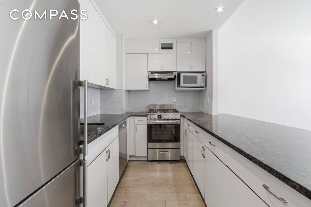 Renovated to perfection, this large 1 Bedroom home has bright and sunny west facing windows plus an oversized Island kitchen.