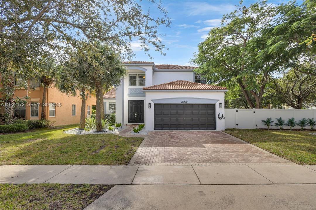 This spacious 4 bedroom, 3 bath home is located in the guard gated community of Riviera Isles.